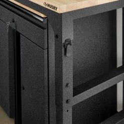 Husky 6 ft. Adjustable Height Solid Wood Top Workbench in Black with LINE-X Coating for Pro Duty Welded Steel Storage System -ToolHub Shop husky workbenches htc1000004 lx 1d 1000